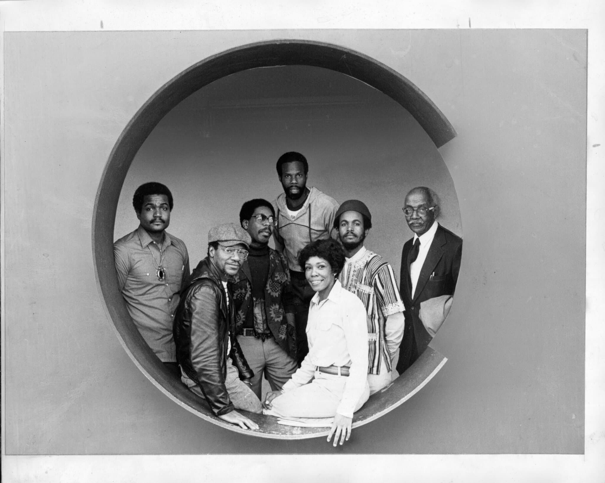 A black-and-white photo of members of a collective.